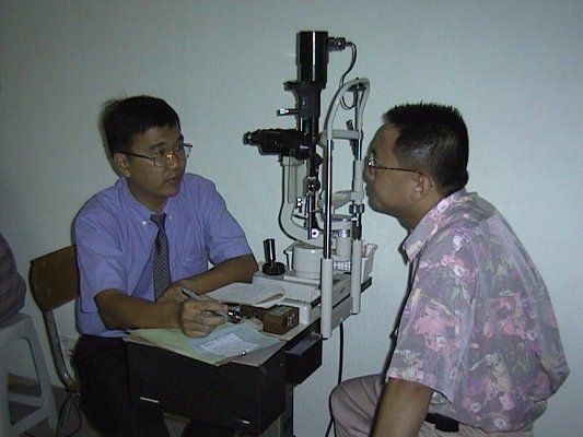 Dr. Kong examining a patient