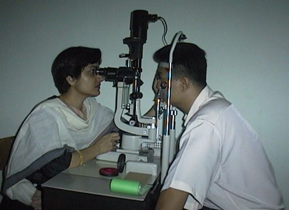 Dr. Luna examining a patient on the Slit Lamp