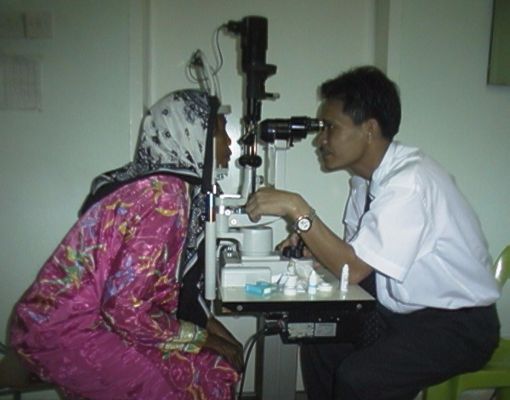 MA Awang examining a patient on the slit lamp