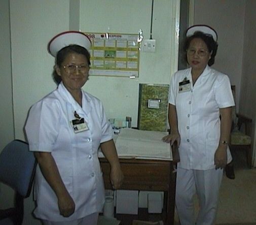 smiling faces in the clinic, TAN Jimis and TAN Lucy.